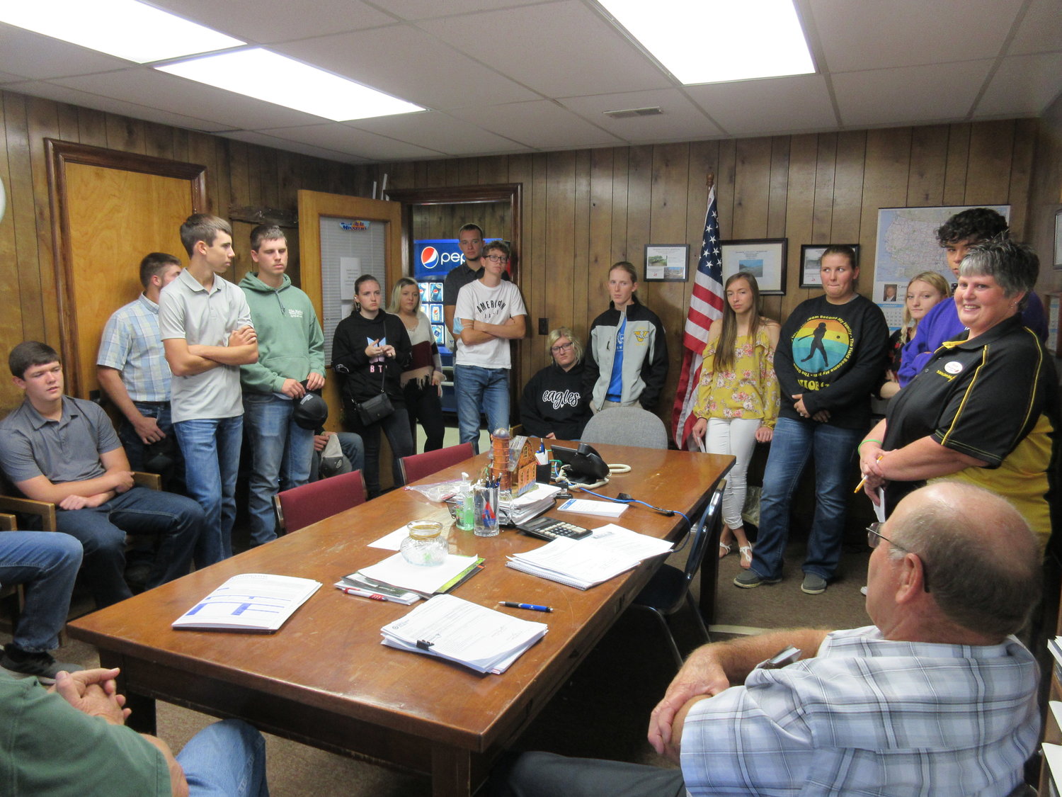 A group of seniors from Vienna High School (left) spent some time at the county commission last Tuesday for Government Day. Brenda Johnson was the adult leader who took them to the different county offices.  Belle High School government students (photo right) were bussed Vienna last week for Government Day sponsored by the Maries County Extension Council. Sara Stratman volunteered to lead the group to the county offices. They are pictured visiting the county commission meeting.